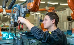 maintenance-repair-and-overhaul-echnical-worker-performs-maintenance-robotic-arms